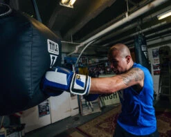 Fighting Sports Big Logo Bag Gloves and 180β Semi-Elastic Hand Wraps Bundle - Professional Training Set 33 Fighting Sports Big Logo Bag Gloves and 180β Semi-Elastic Hand Wraps Bundle - Professional Training Set -Title Boxing Store FSABG2BLBKWH 1 Fighting Sports Gloves and Wraps Bundle